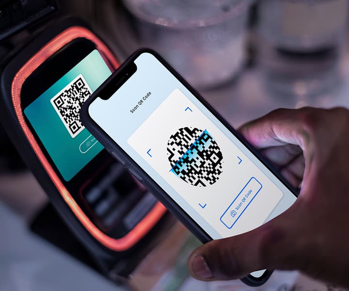 Paying via QR code scan at a contactless payment terminal